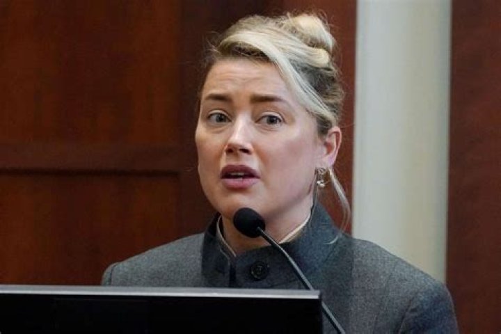 Amber Heard denies pooping on Johnny Depp's side of the bed in testimony, blames dog
